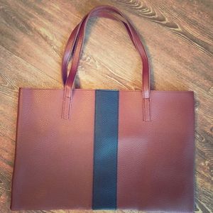 Vincent Camuto Luck tote is desert red.